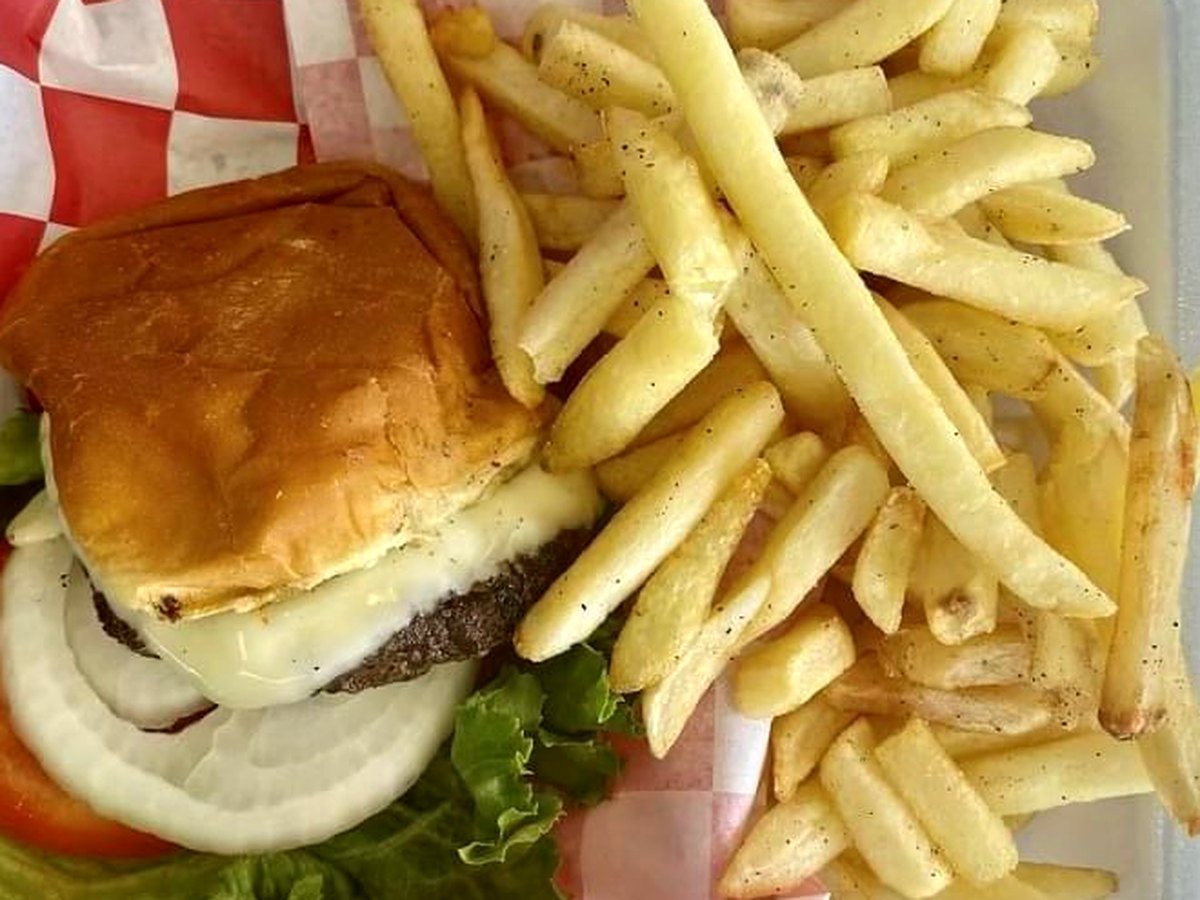 Charbroiled burger served with fries