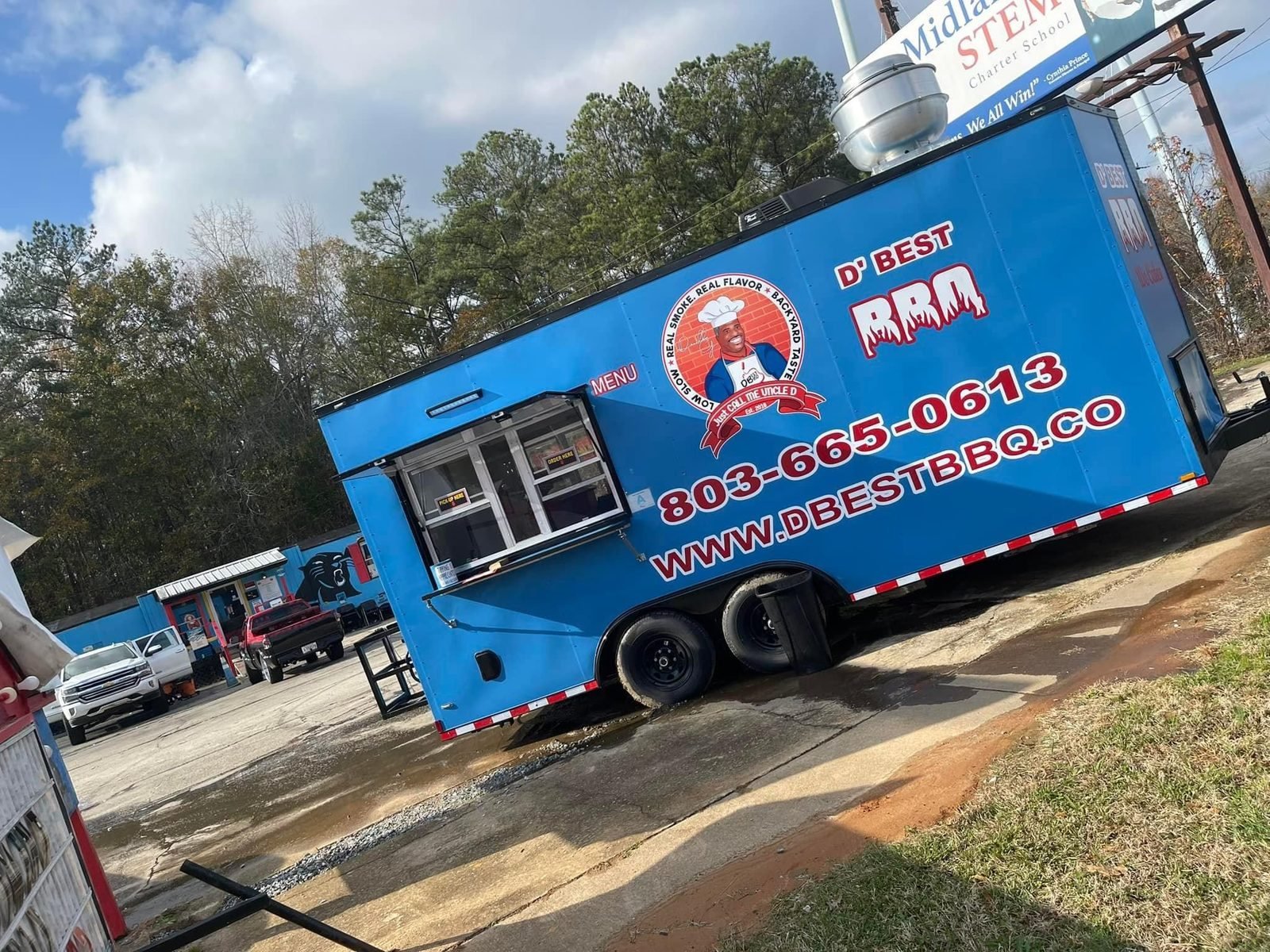 The D'Best BBQ truck set up outdoors